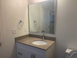 Bathroom with vanity and toilet