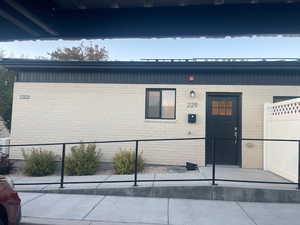 Entrance to property with brick siding