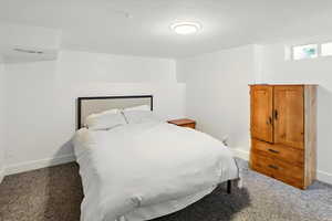 Carpeted bedroom with baseboards