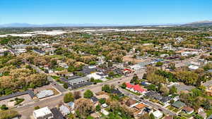 Aerial view of residential area featuring a mountainous background