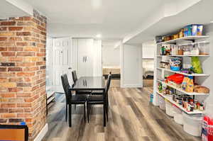 Dining space with light wood-style flooring and baseboards