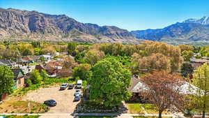 View of mountain backdrop featuring nearby suburban area