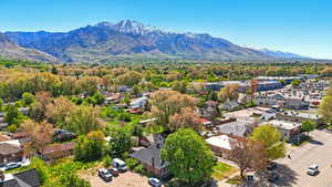 Aerial view of residential area featuring a mountain backdrop