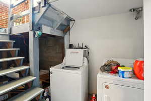 Laundry room with washing machine and clothes dryer