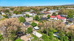 Aerial view of residential area featuring a tree filled landscape
