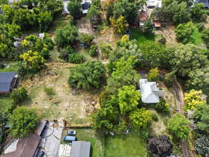 View of property location featuring a tree filled landscape