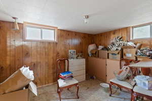 Miscellaneous room featuring wooden walls