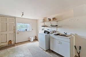 Laundry area with washer / clothes dryer and cabinet space