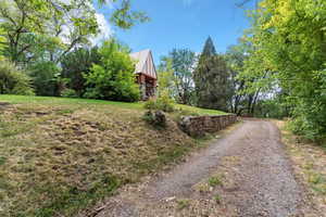 View of street featuring view of wooded area