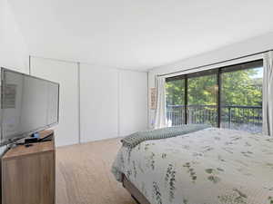 Master bedroom with a newly built balcony with water views.