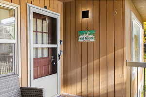 Unit 1 entrance, featuring board and batten siding