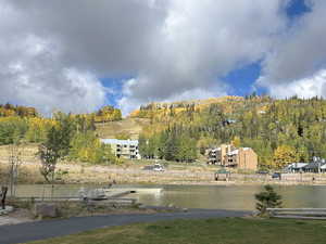 View of grassy yard with a water view