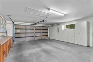 Garage featuring a garage door opener