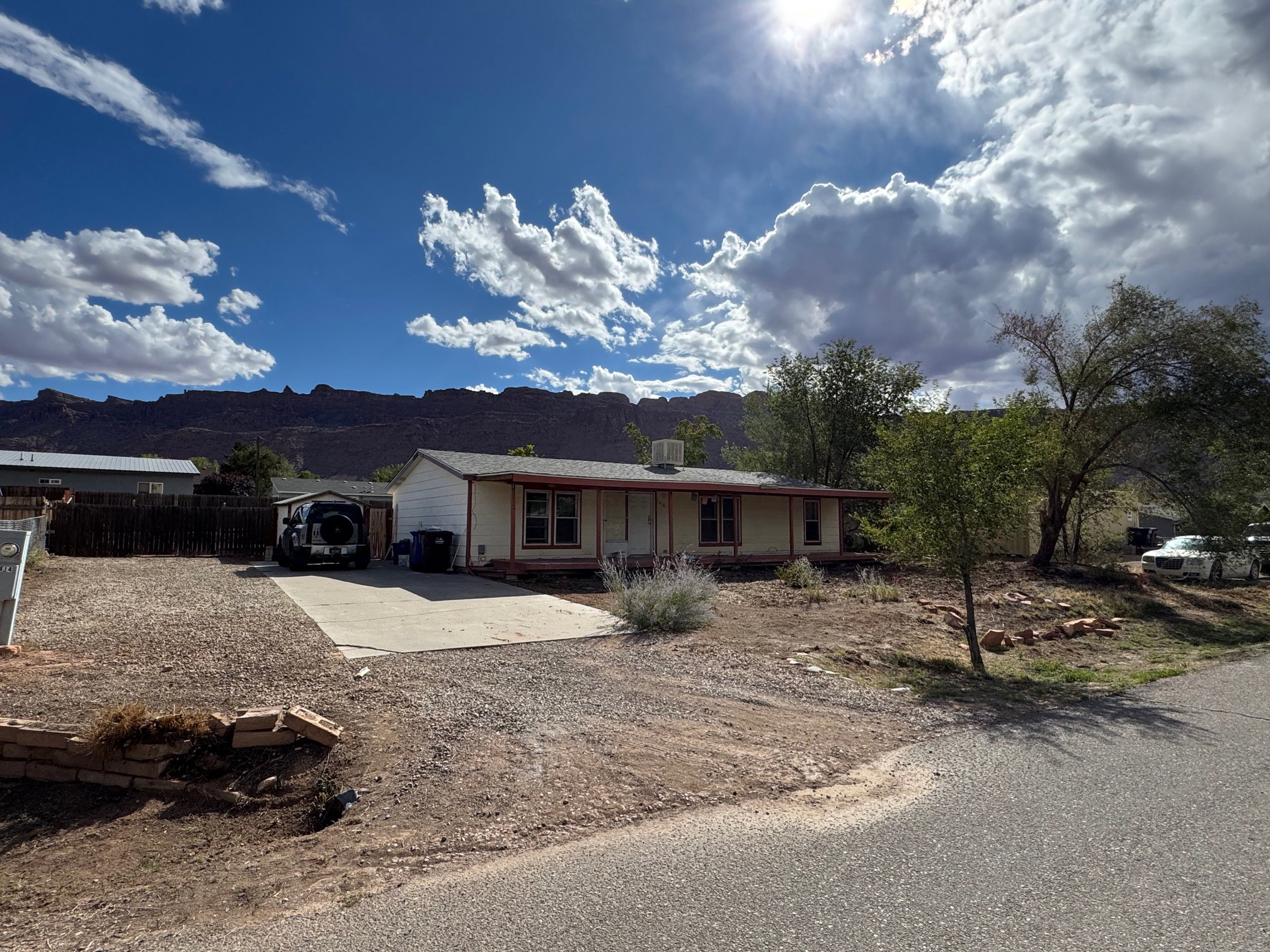 Ranch-style home featuring GRAVEL driveway and a mountain view