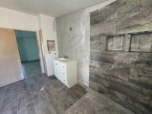 MASTER Bathroom featuring LVP floors and walk in shower
