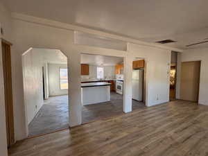 Open floor plan, NEW LVP floors, and white appliances