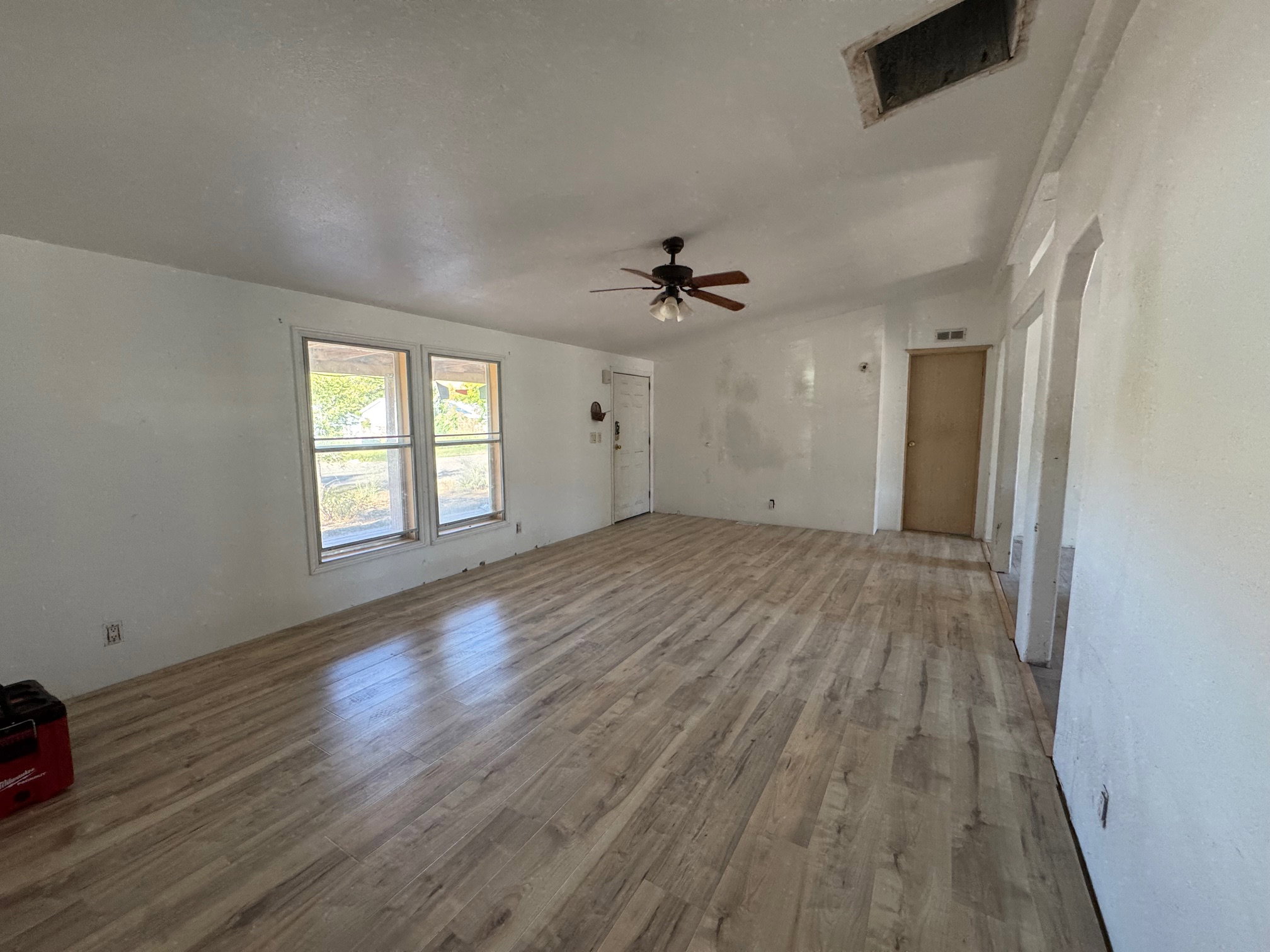 Unfurnished living room with NEW LVP finished floors and ceiling fan