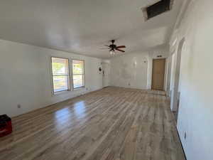 Unfurnished living room with NEW LVP finished floors and ceiling fan
