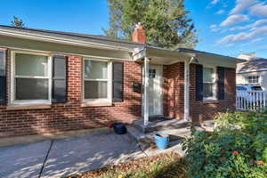 View of front of home featuring brick.