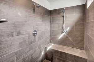 Bathroom featuring tiled shower