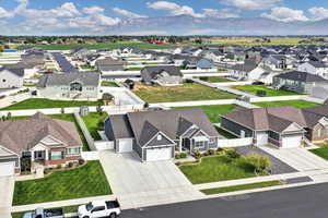 Aerial view of residential area featuring a mountainous background