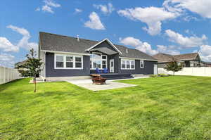 Back of property with a patio, an outdoor fire pit, stucco siding, and a shingled roof