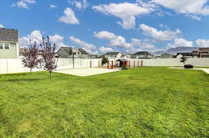 Fenced backyard with a residential view