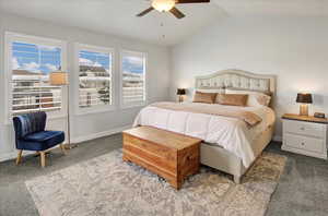 Bedroom with carpet flooring, lofted ceiling, and ceiling fan