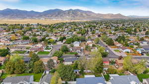 Aerial view of residential area featuring a mountain backdrop