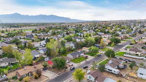 Aerial perspective of suburban area with a mountainous background