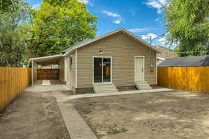 Rear view of house with entry steps