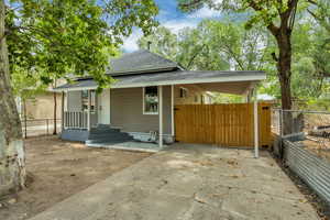 Bungalow-style house featuring roof with shingles