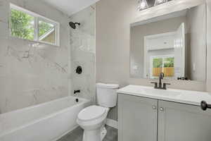 Full bath with bathing tub / shower combination and vanity