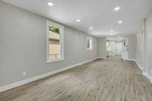 Unfurnished living room featuring recessed lighting and light wood finished floors