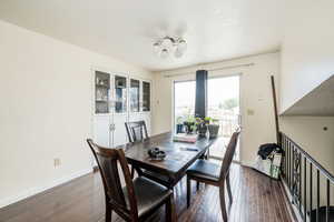 Dining area featuring dark wood finished floors and a textured ceiling
