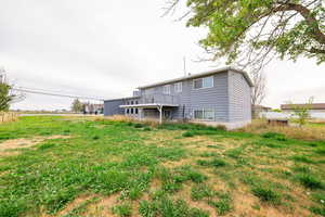 Rear view of house with a deck