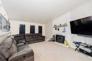 Carpeted living room with baseboards