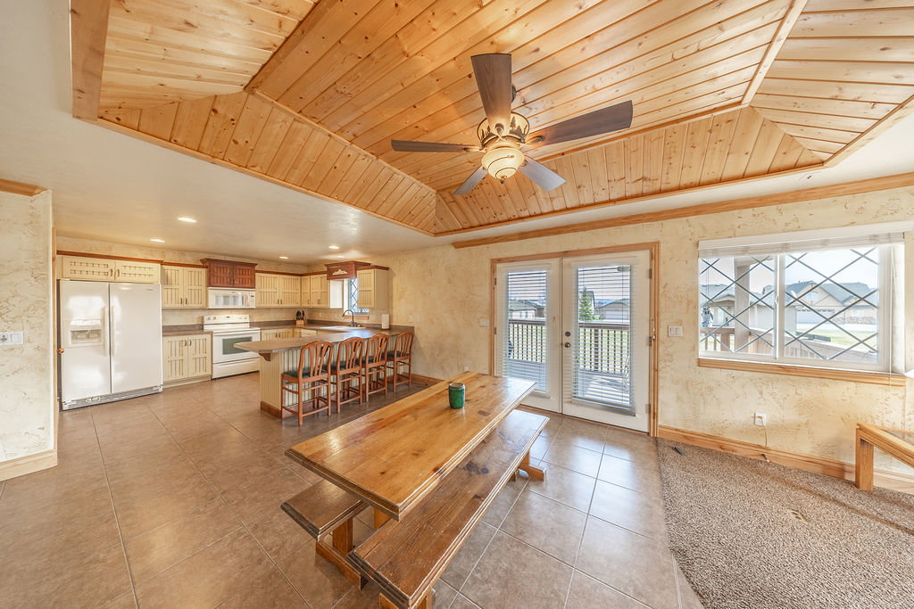 Dining space featuring recessed lighting, ceiling fan, a vaulted wood ceiling, french doors, and light tile patterned floors