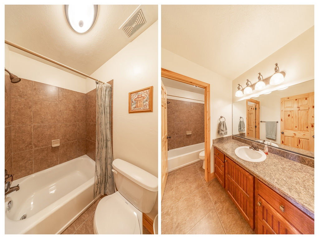 Full bath featuring shower / bath combo with shower curtain, vanity, and light tile patterned floors