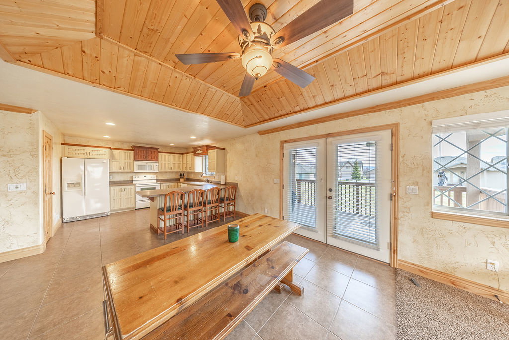Dining room featuring french doors, wooden ceiling, a ceiling fan, light tile patterned flooring, and recessed lighting