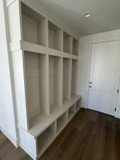Mudroom with dark wood-style flooring