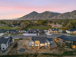 Aerial perspective of suburban area with a mountain backdrop