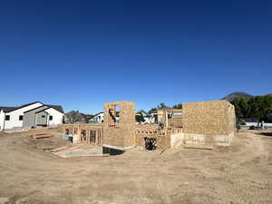 Back of house with a pergola