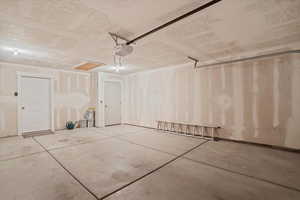 Garage featuring a garage door opener