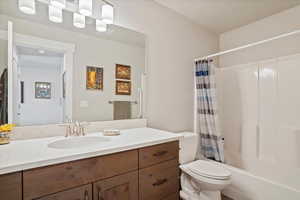 Full bathroom with vanity and shower / tub combo with curtain