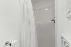 Full bath featuring a shower with curtain