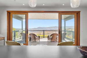 Dining room featuring a mountain view and recessed lighting