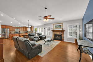 Great room with, vaulted ceilings sliding door to backyard, plantation shutters and gas fireplace