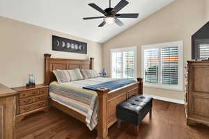 Master Bedroom with hardwood flooring, a ceiling fan,  high vaulted ceiling, large windows to backyard and plantation shutters