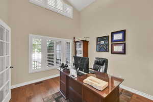 Office with beautiful  hardwood flooring and high vaulted ceiling